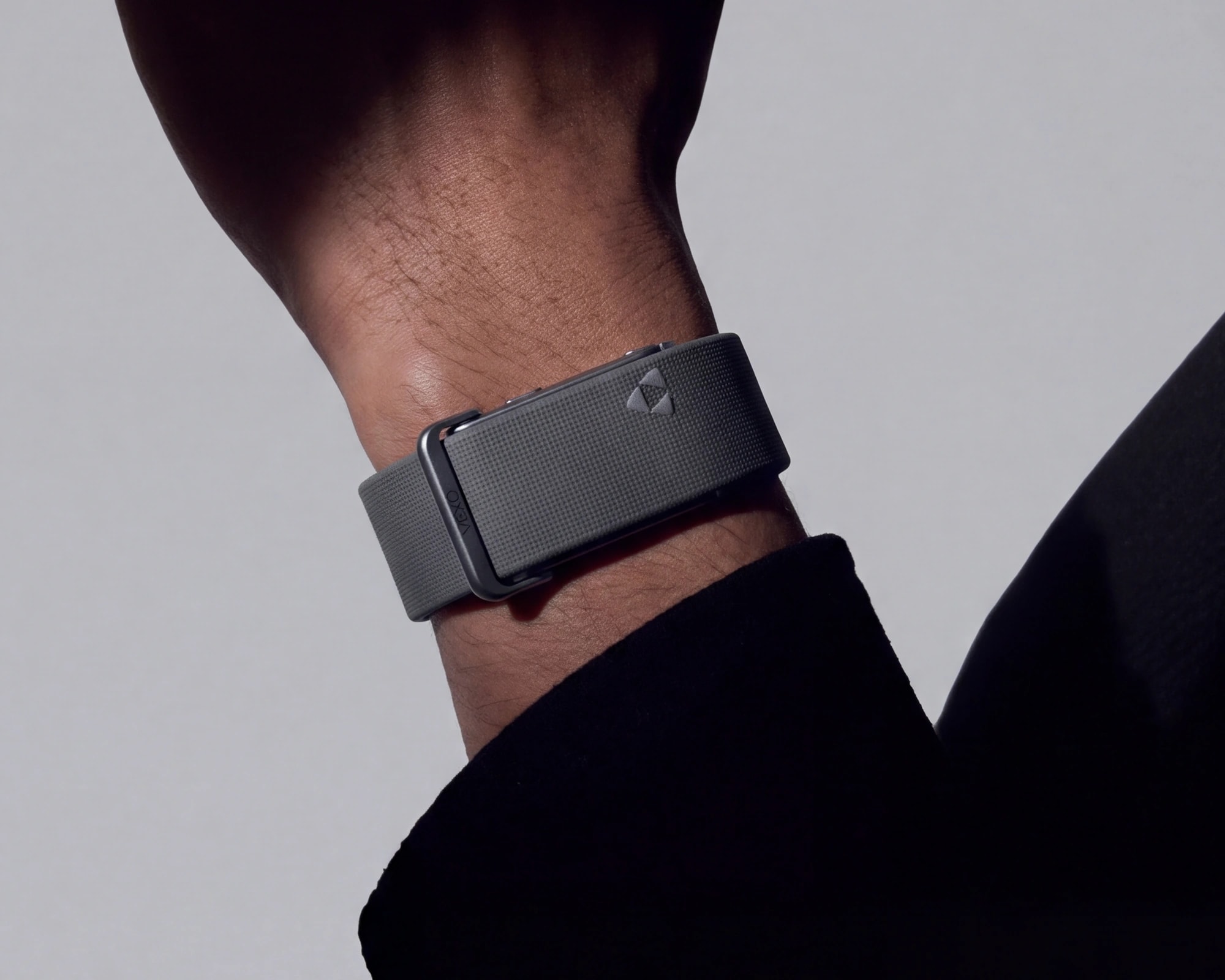 Graphite, Vexo Band worn on a wrist